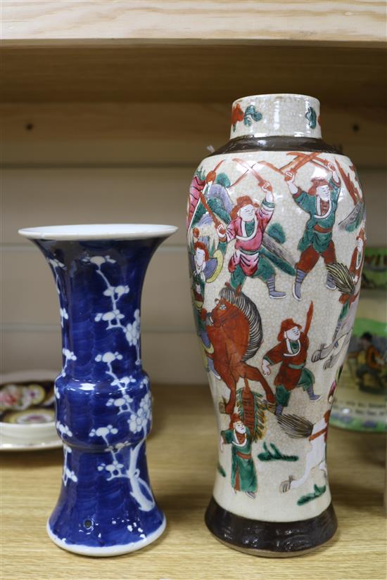 A Chinese blue and white Gu vase, decorated with prunus blossom and a crackleware vase, H 20cm & 29cm